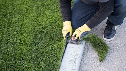 contractor installing artificial turf